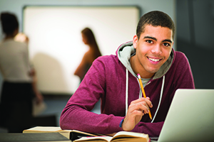 Young Man learning on laptop